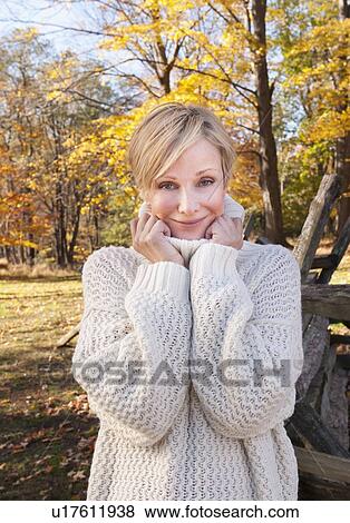 Portrait of smiling woman in Autumn forest View Large Photo Image Stock Photo - Portrait of smiling woman in Autumn forest. Fotosearch