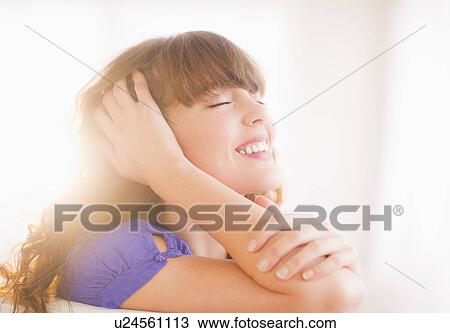 Portrait of smiling woman in backlit View Large Photo Image Stock Image - Portrait of smiling woman in backlit. Fotosearch