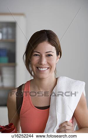 Portrait of smiling woman in gym View Large Photo Image Picture - Portrait of smiling woman in gym. Fotosearch