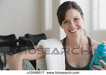 Portrait of smiling woman in gym View Large Photo Image Stock Photo - Portrait of smiling woman in gym. Fotosearch