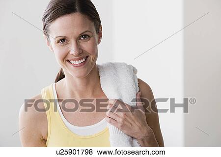 Stock Photo - Portrait of smiling woman in gym. Fotosearch
