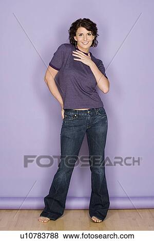 Portrait of smiling woman on purple background, studio shot View Large Photo Image Stock Photo - Portrait of smiling woman on purple background, studio shot. Fotosearch