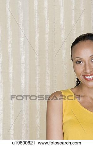 Portrait of smiling woman on striped background, studio shot View Large Photo Image Stock Image - Portrait of smiling woman on striped background, studio shot. Fotosearch
