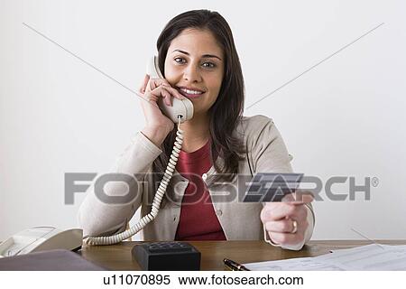 Portrait of smiling woman talking on phone View Large Photo Image Stock Photography - Portrait of smiling woman talking on phone. Fotosearch
