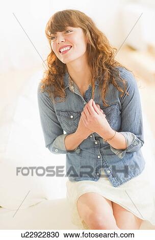 Portrait of smiling young woman View Large Photo Image Stock Image - Portrait of smiling young woman. Fotosearch