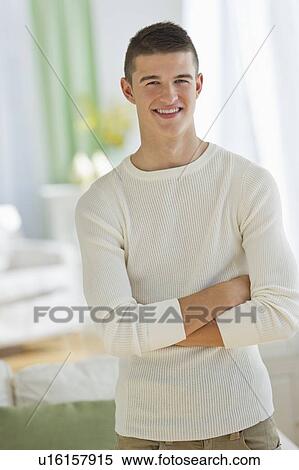 Stock Photography - Portrait of teen (16-17) boy at home. Fotosearch