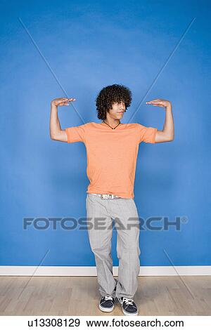 Stock Photo - Portrait of teenage boy (14-15) posing. Fotosearch