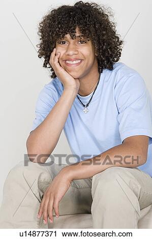 Stock Image - Portrait of teenage boy (14-15). Fotosearch