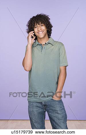 Portrait of teenage boy (14-15) talking on mobile phone View Large Photo Image Stock Photo - Portrait of teenage boy (14-15) talking on mobile phone. Fotosearch