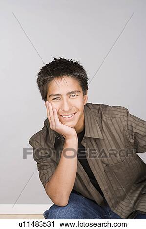 Stock Image - Portrait of teenage boy (16-17). Fotosearch