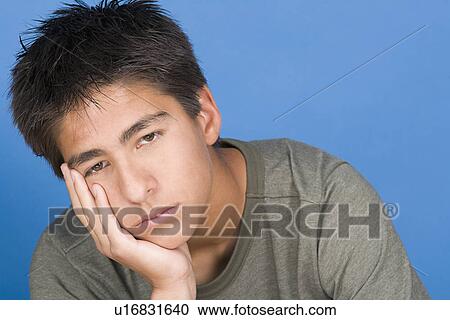 Portrait of teenage boy (16-17) View Large Photo Image Stock Image - Portrait of teenage boy (16-17). Fotosearch