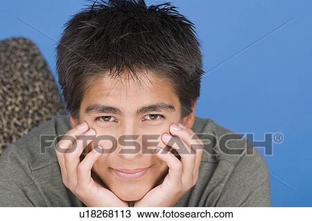 Portrait of teenage boy (16-17) View Large Photo Image Stock Image - Portrait of teenage boy (16-17). Fotosearch