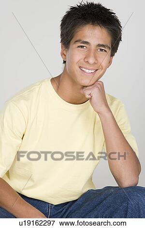 Stock Photo - Portrait of teenage boy (16-17). Fotosearch