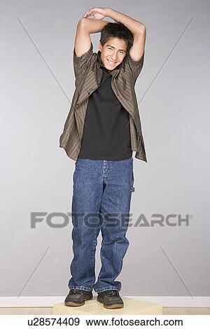 Stock Photo - Portrait of teenage boy (16-17). Fotosearch
