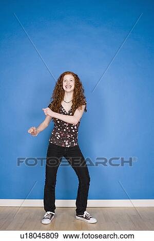 Portrait of teenage girl (16-17) dancing View Large Photo Image Stock Photo - Portrait of teenage girl (16-17) dancing. Fotosearch