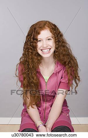 Stock Image - Portrait of teenage girl (16-17). Fotosearch