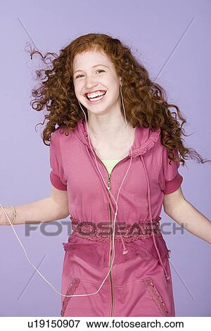 Portrait of teenage girl (16-17) listening to mp3 player View Large Photo Image Stock Photo - Portrait of teenage girl (16-17) listening to mp3 player. Fotosearch