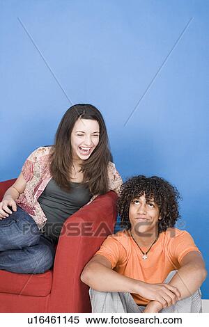 Stock Photography - Portrait of teenage girl and boy (14-15, 16-17). Fotosearch