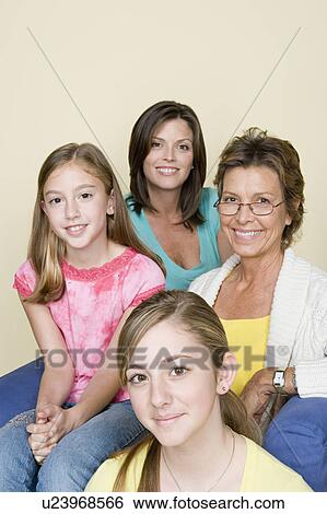 Stock Photograph - Portrait of three generation family with two girls (8-9, 14-15). Fotosearch