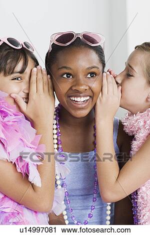 Portrait of three girls (10-11) gossiping View Large Photo Image Stock Image - Portrait of three girls (10-11) gossiping. Fotosearch