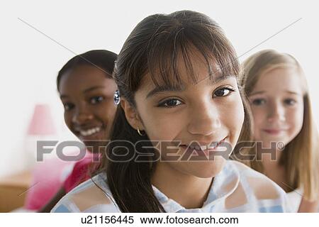 Stock Photography - Portrait of three girls (10-11) . Fotosearch