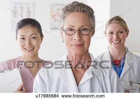 Portrait of three smiling female doctors View Large Photo Image Picture - Portrait of three smiling female doctors. Fotosearch