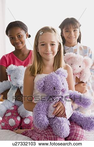 Portrait of three smiling girls (10-11) with puppets View Large Photo Image Stock Image - Portrait of three smiling girls (10-11) with puppets. Fotosearch