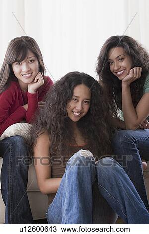 Portrait of three young women smiling View Large Photo Image Stock Image - Portrait of three young women smiling. Fotosearch