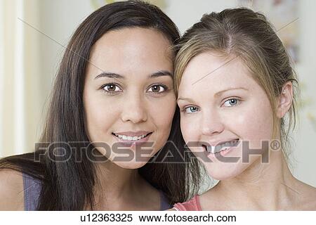 Stock Photography - Portrait of two attractive women. Fotosearch