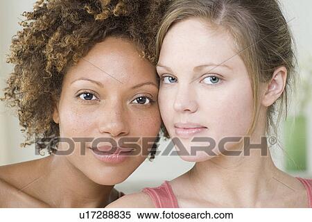 Stock Photography - Portrait of two attractive women. Fotosearch
