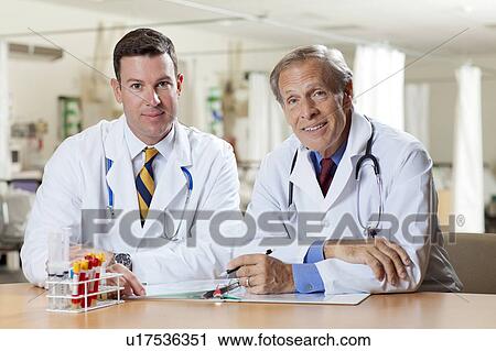 Portrait of two doctors in hospital View Large Photo Image Stock Image - Portrait of two doctors in hospital. Fotosearch