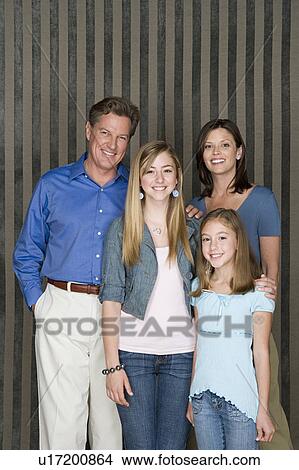 Portrait of two generation family with two daughters (8-9, 14-15) View Large Photo Image Picture - Portrait of two generation family with two daughters (8-9, 14-15). Fotosearch