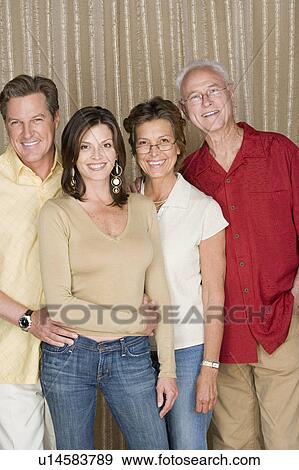 Stock Photo - Portrait of two-generation family with adult offspring. Fotosearch