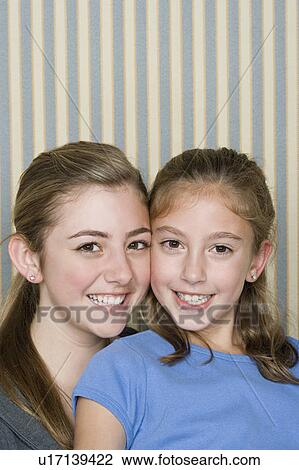 Portrait of two happy girls (14-15, 8-9) View Large Photo Image Stock Image - Portrait of two happy girls (14-15, 8-9). Fotosearch