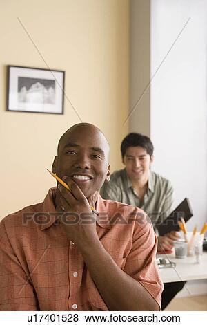 Portrait of two office workers View Large Photo Image Stock Photo - Portrait of two office workers. Fotosearch