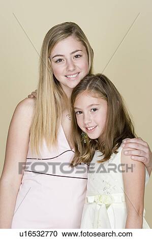 Portrait of two sisters (14-15, 8-9) View Large Photo Image Stock Image - Portrait of two sisters (14-15, 8-9). Fotosearch