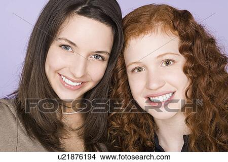 Portrait of two teenage girls (16-17) standing together View Large Photo Image Picture - Portrait of two teenage girls (16-17) standing together. Fotosearch