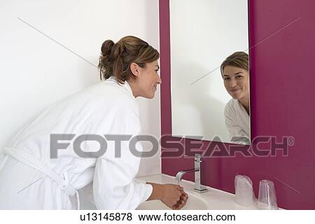 , Portrait of woman in bathroom View Large Photo Image Stock Photo - , Portrait of woman in bathroom. Fotosearch