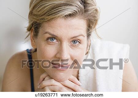 Stock Image - Portrait of woman in gym. Fotosearch
