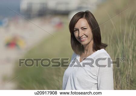 Portrait of woman on beach View Large Photo Image Stock Photo - Portrait of woman on beach. Fotosearch