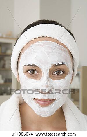 Picture - Portrait of woman with facial mask. Fotosearch