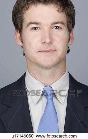 Stock Image - Portrait of young businessman. Fotosearch