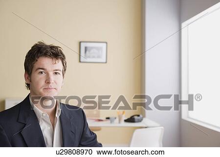 Stock Image - Portrait of young businessman. Fotosearch