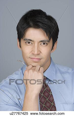 Portrait of young businessman View Large Photo Image Stock Photography - Portrait of young businessman. Fotosearch