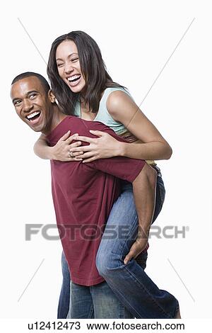 Portrait of young couple enjoying together View Large Photo Image Stock Image - Portrait of young couple enjoying together. Fotosearch