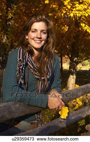 Portrait of young woman on ranch View Large Photo Image Stock Image - Portrait of young woman on ranch. Fotosearch