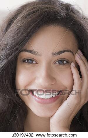 Portrait of young woman smiling View Large Photo Image Stock Image - Portrait of young woman smiling. Fotosearch