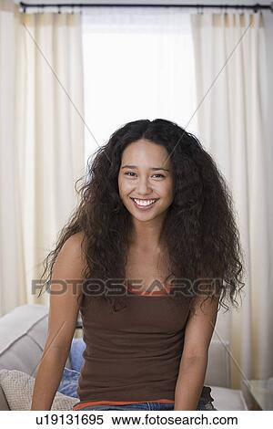 Portrait of young woman smiling View Large Photo Image Stock Photography - Portrait of young woman smiling. Fotosearch