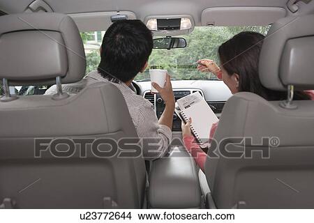 Rear view of couple in car View Large Photo Image Picture - Rear view of couple in car. Fotosearch