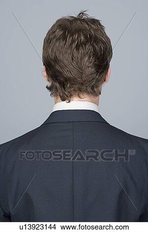 Rear view of young businessman View Large Photo Image Picture - Rear view of young businessman. Fotosearch